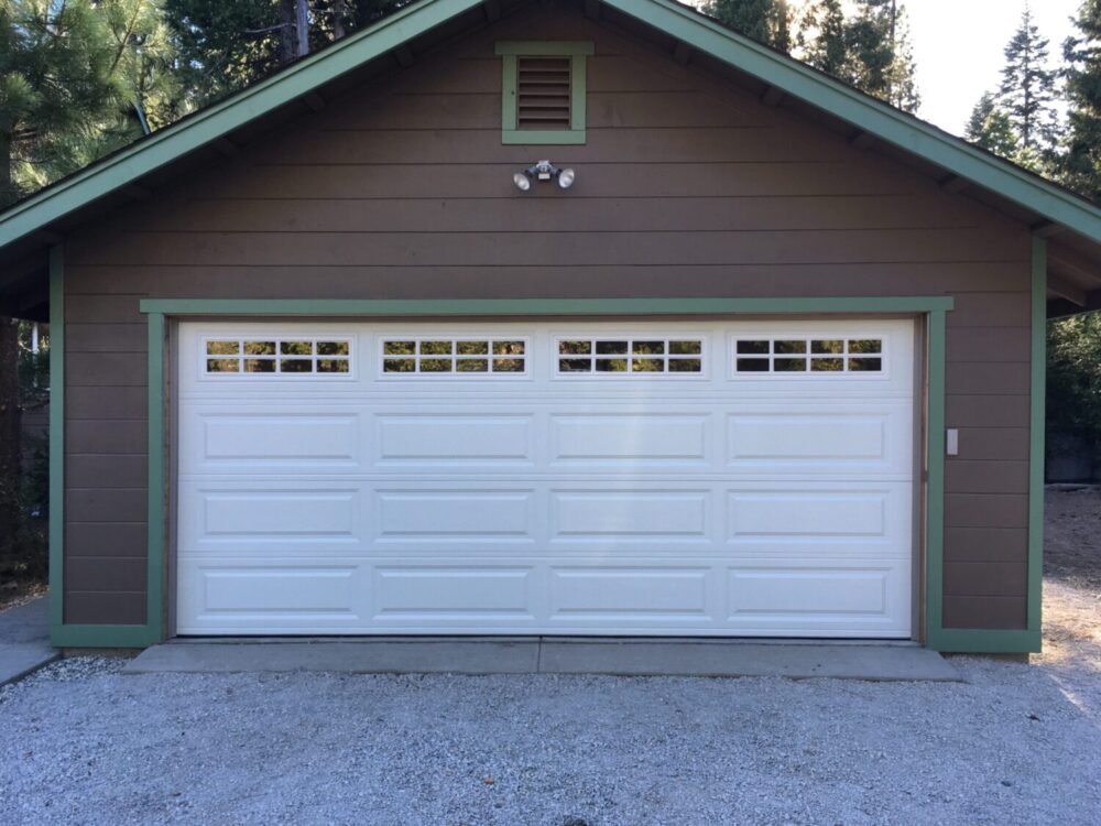 white traditional garage door with windows